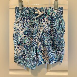 Lilly Pulitzer boys swim trunks in blue and white print with tie waist. Size S